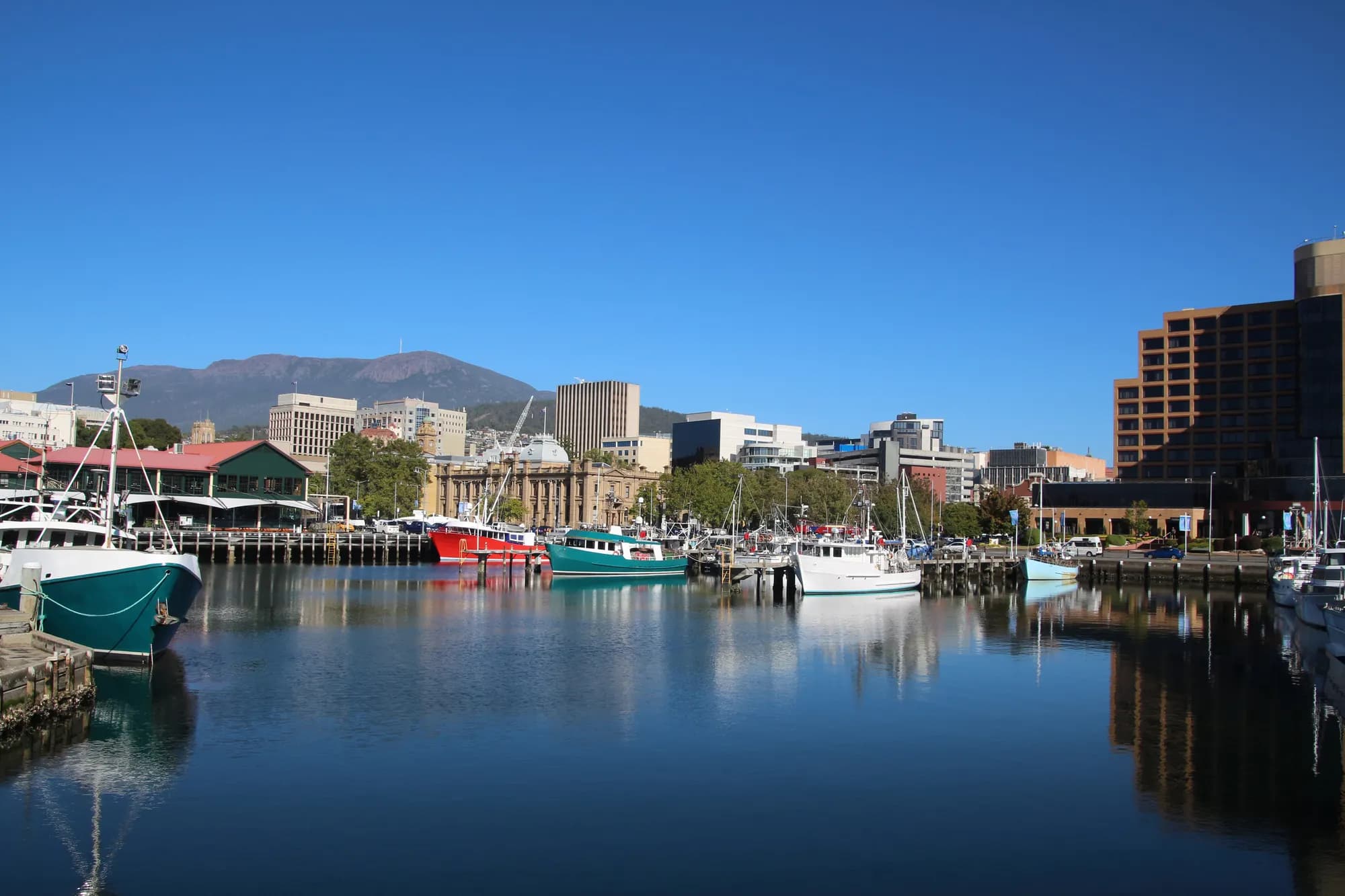 Still water on the Hobart waterfront reflecting the evening sky